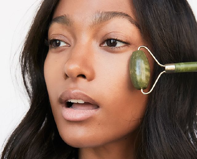 Woman Using Blume Jade Roller