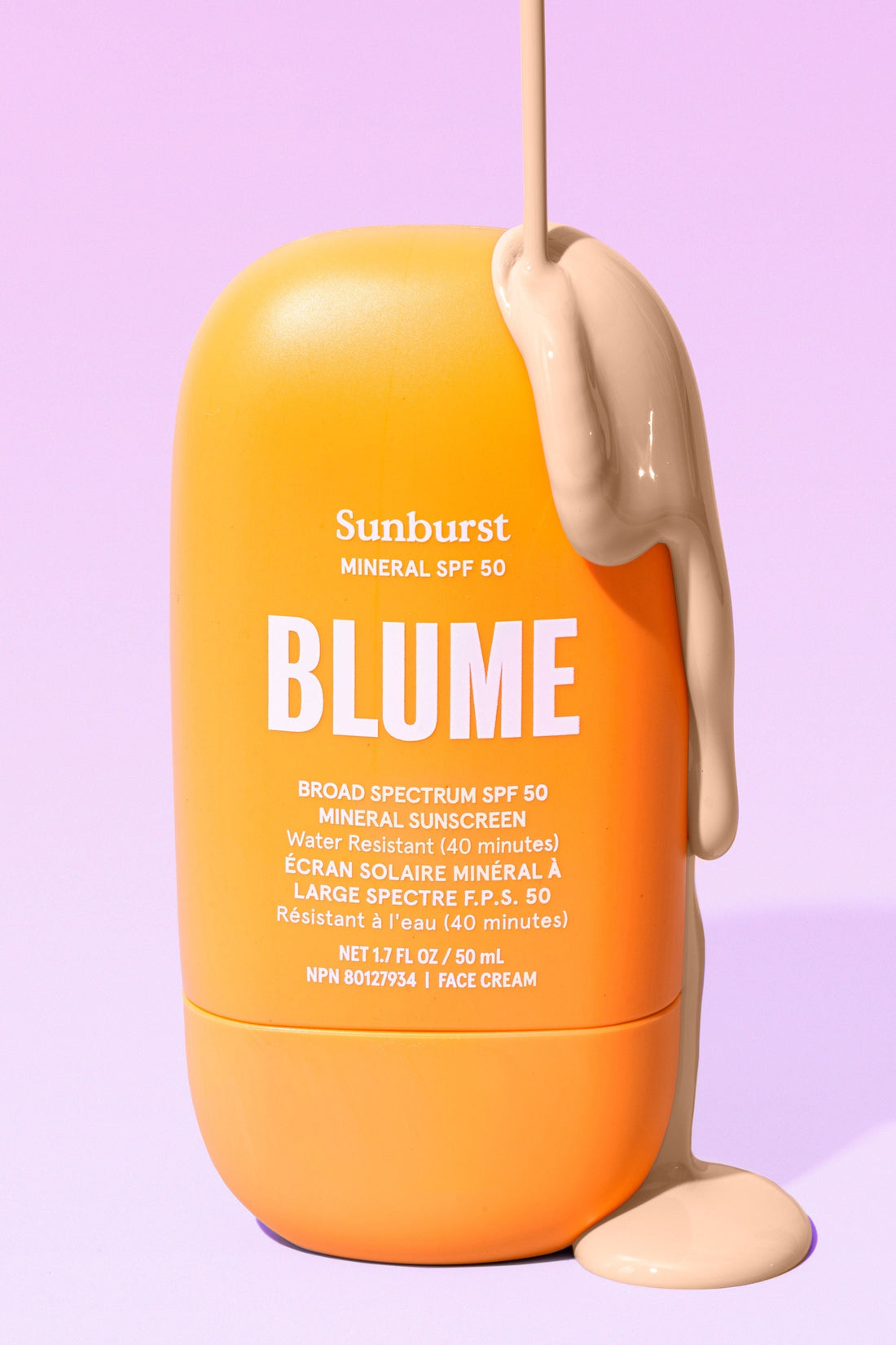 Blume Sunburst Mineral SPF 50 sunscreen with cream texture on pink background