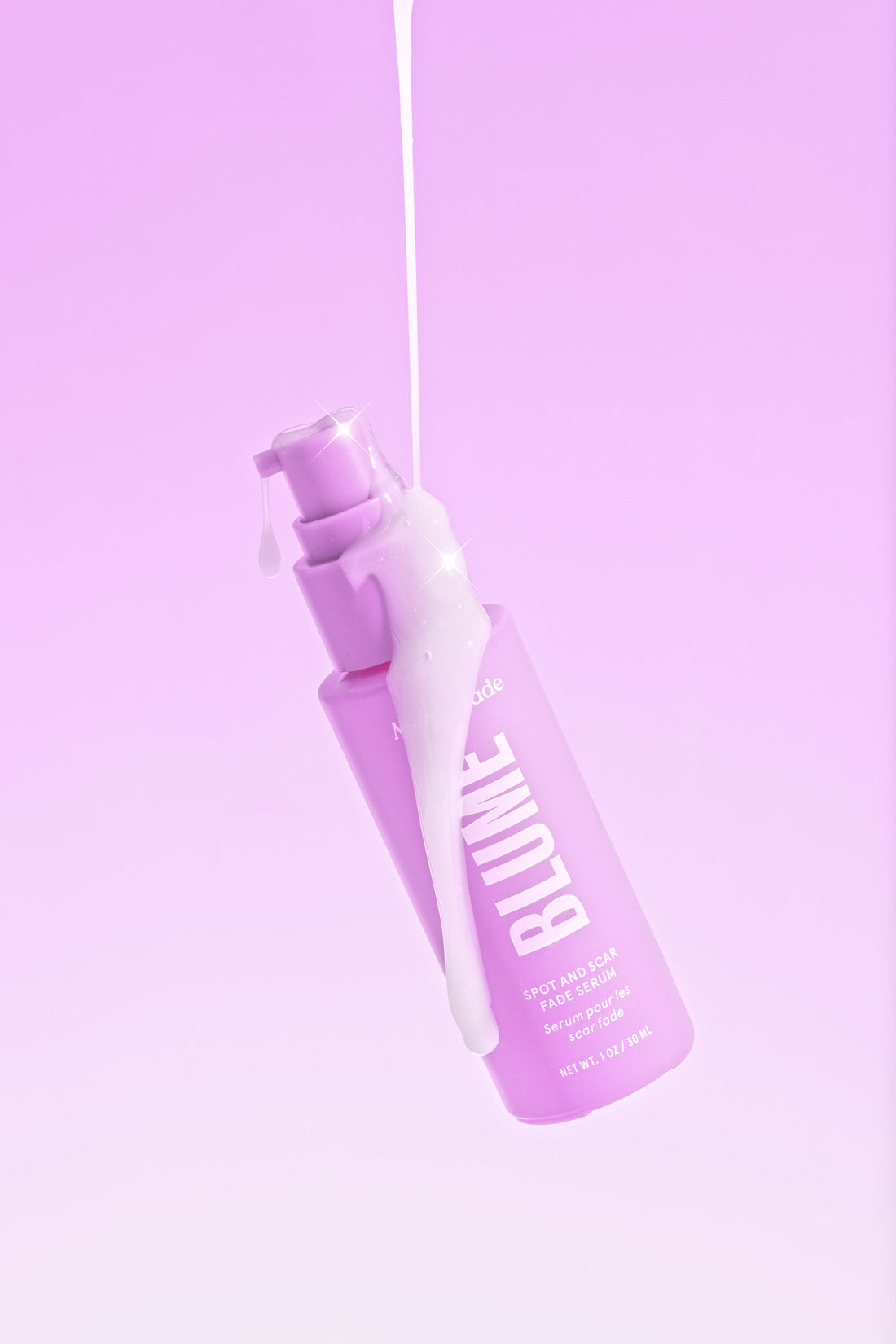 Blume Milky Fade Spot and Scar Serum with bright pink background and serum dripping for radiant skin results