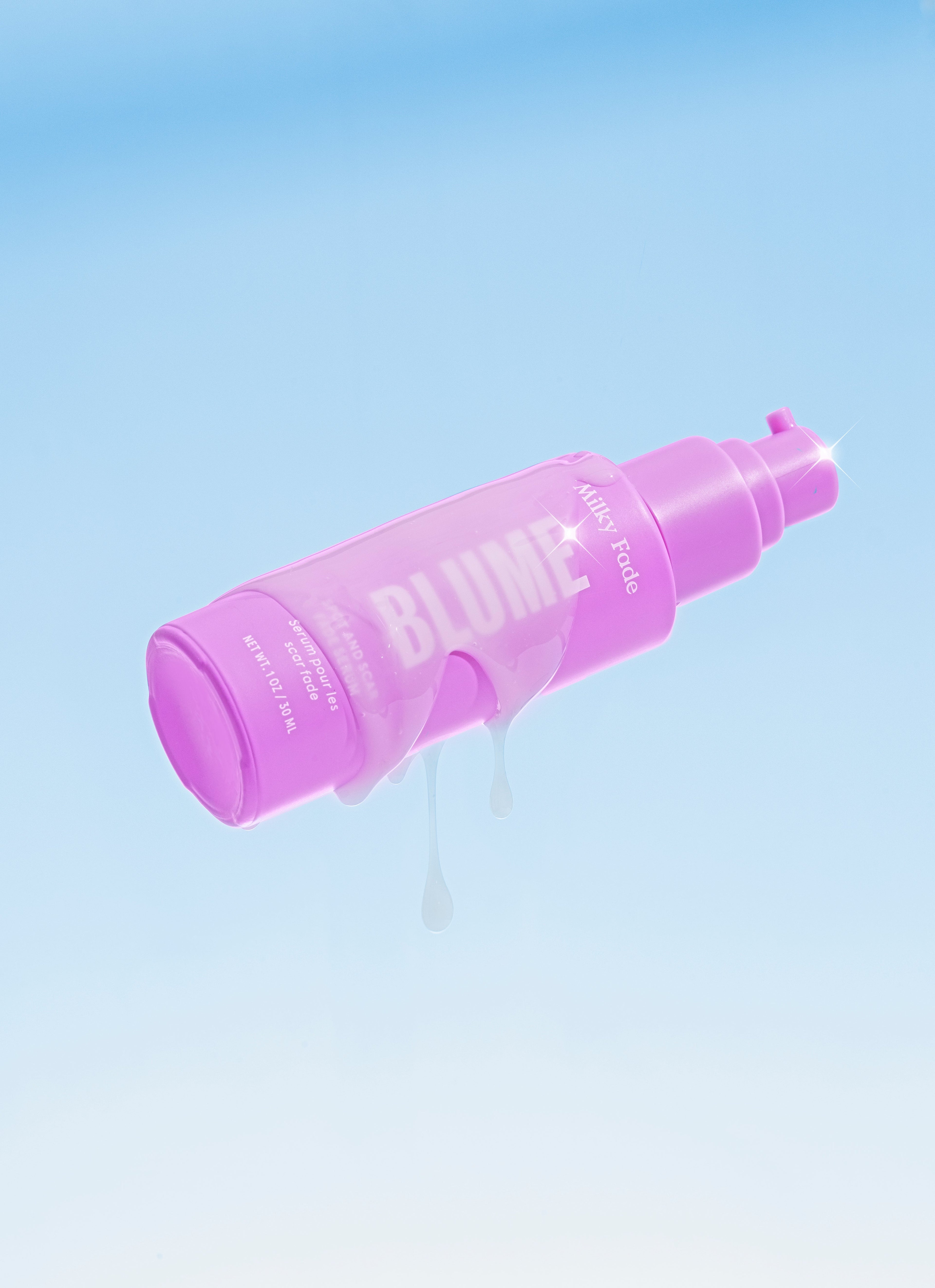 Blume Milky Fade serum bottle with glossy pink packaging and hydrating serum drips against a light blue background.