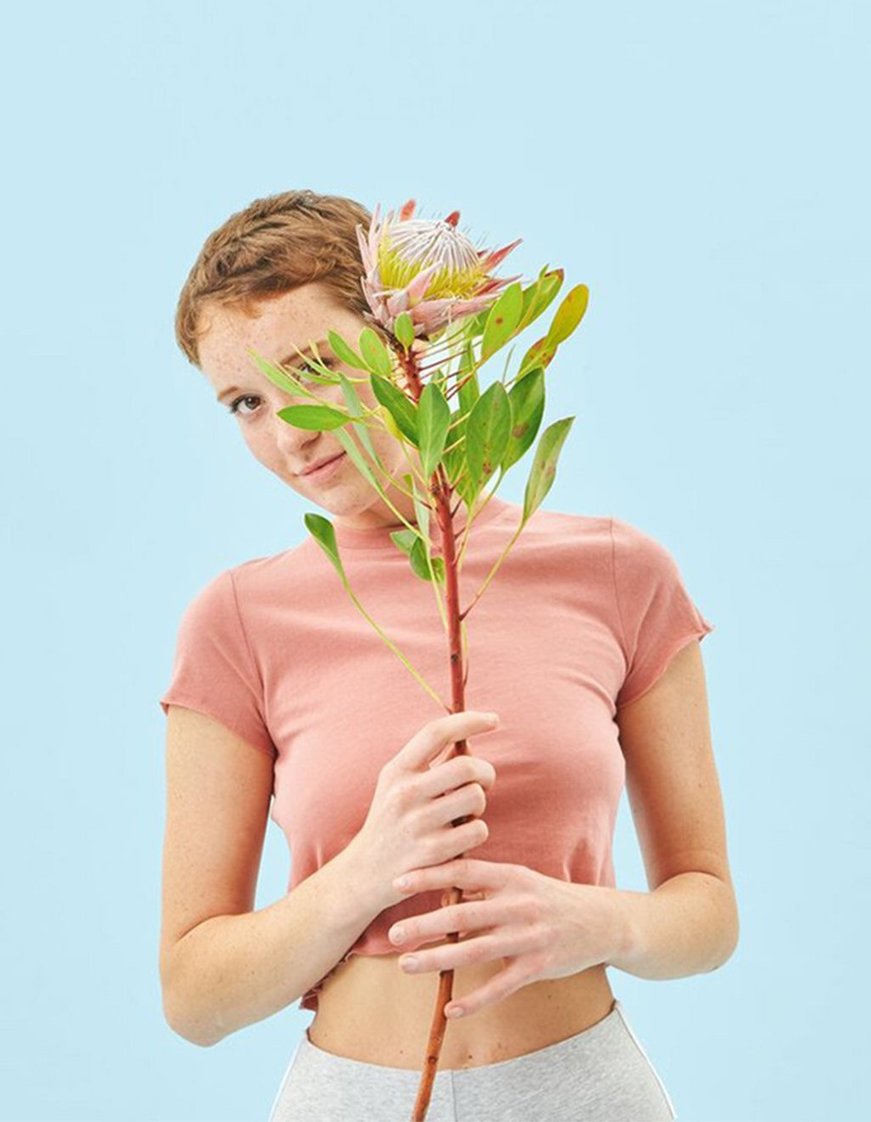 Bloom babe holding a flower