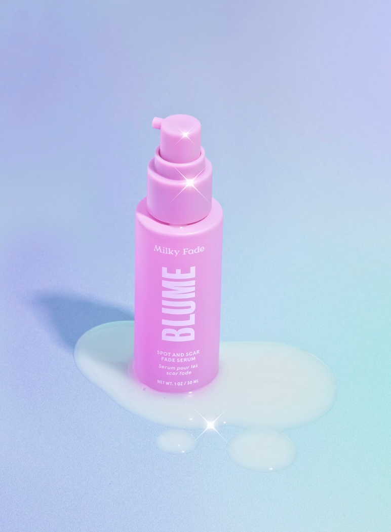Pink bottle of Blume Milky Fade Spot and Scar Fade Serum on a pastel background with spilled serum.