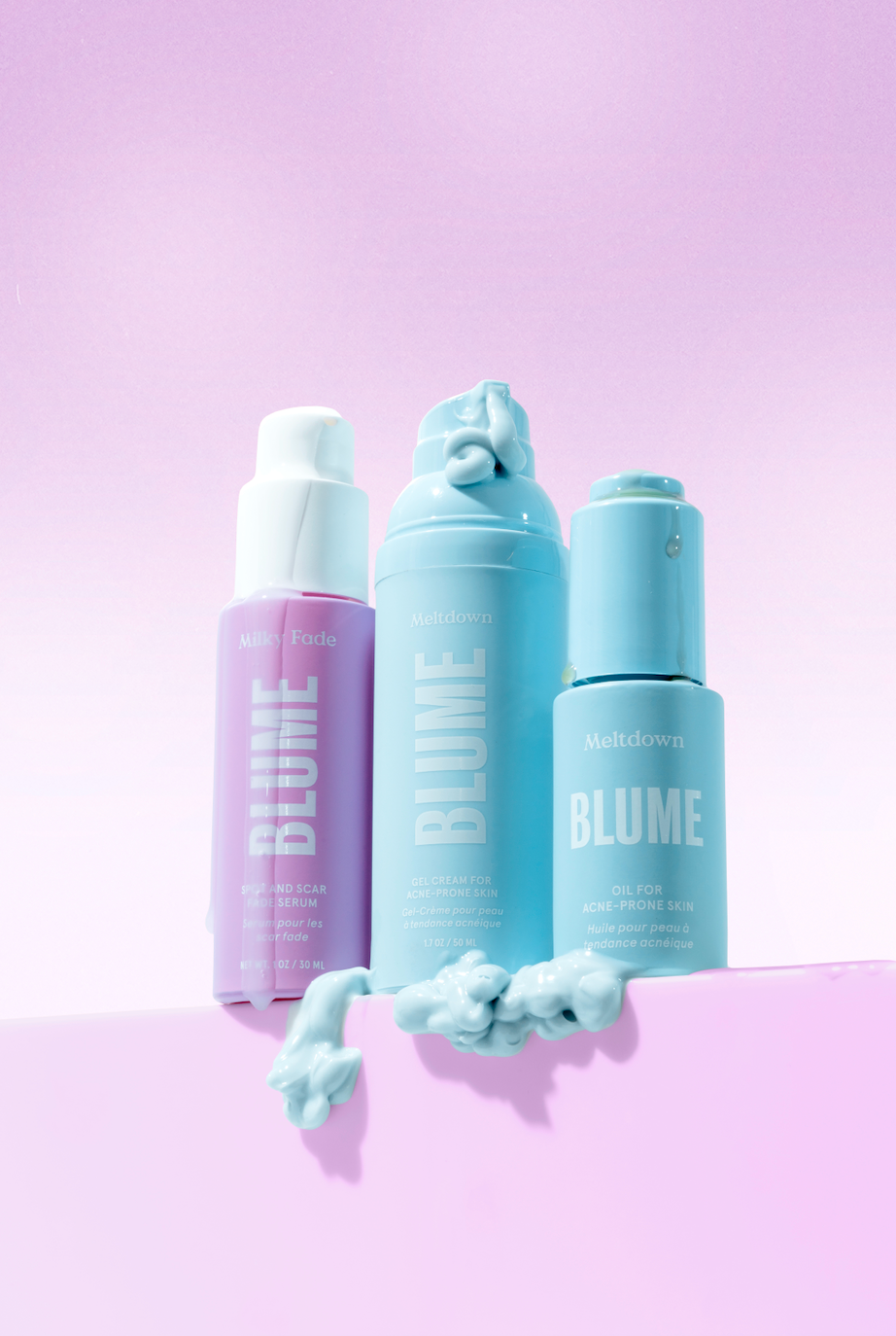 Blume Milky Fade Serum, Meltdown Gel Cream, and Meltdown Oil on a pastel pink background. A gentle trio for acne-prone skin.