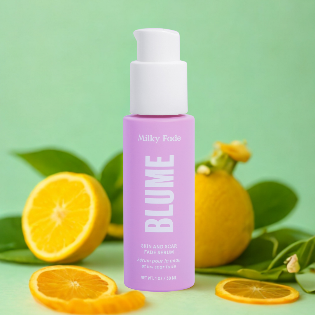Blume Milky Fade Serum bottle with fresh citrus fruit background