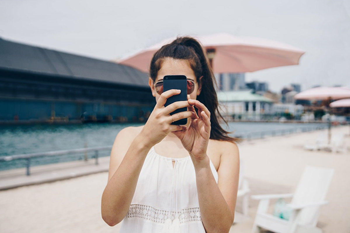 Woman using phone outside